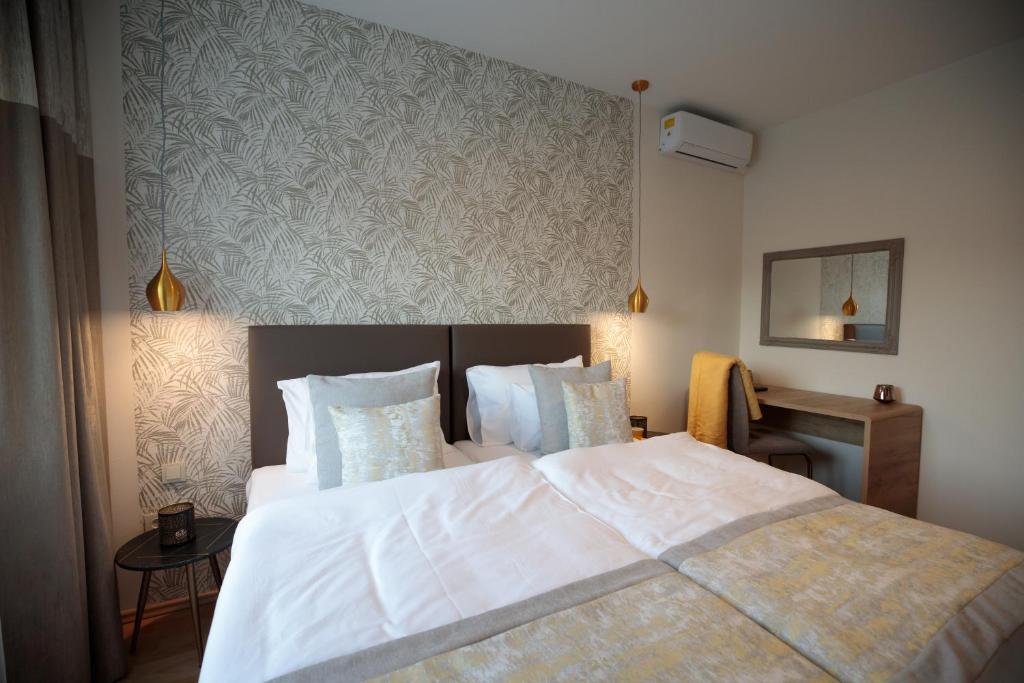 Posteľ alebo postele v izbe v ubytovaní Mokka Best Apartments