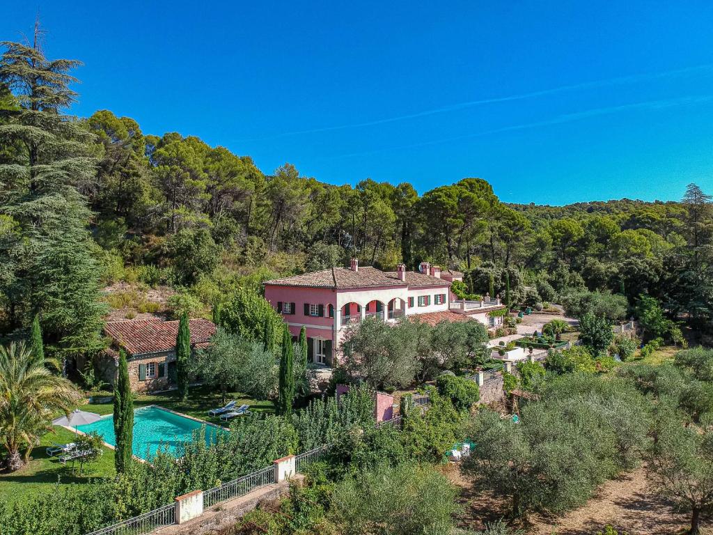an estate in the hills with a pool and trees at Gites de la Villa Pergola in Salernes