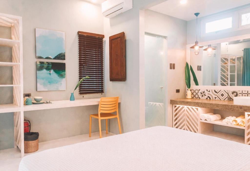 Postel nebo postele na pokoji v ubytování MUNI MUNI VILLAS SIARGAO