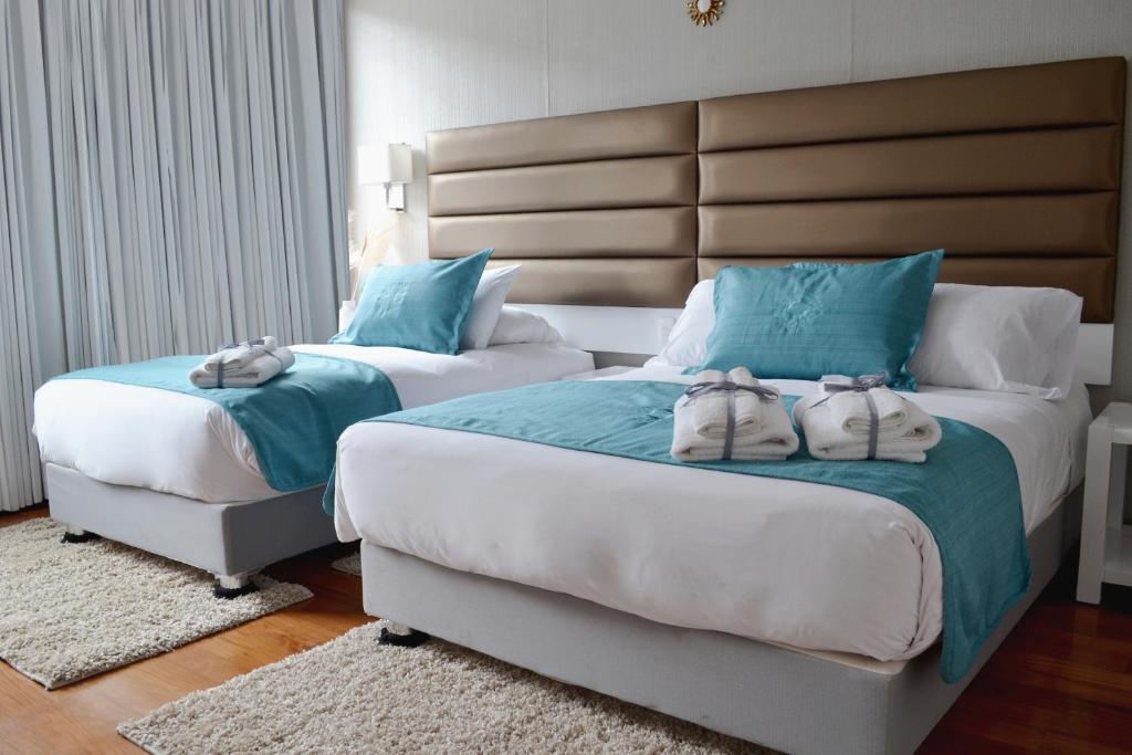 Postel nebo postele na pokoji v ubytování Katari Apart Hotel at Qorikancha