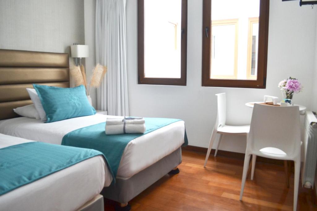 Postel nebo postele na pokoji v ubytování Katari Apart Hotel at Qorikancha