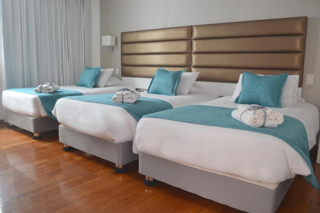 Postel nebo postele na pokoji v ubytování Katari Apart Hotel at Qorikancha