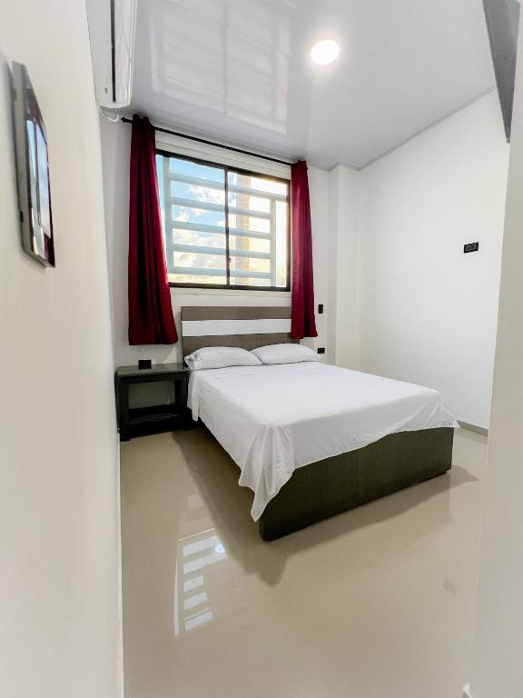Cama o camas de una habitación en Sagrado Hotel
