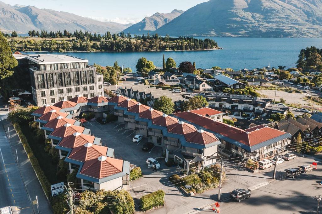 an aerial view of a resort with a lake and mountains at Blue Peaks Lodge in Queenstown