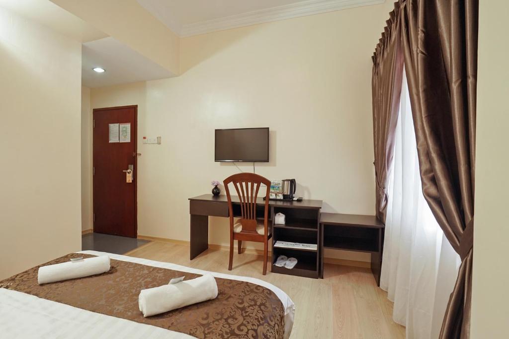 TV a/nebo společenská místnost v ubytování RJ Hotel Kulai