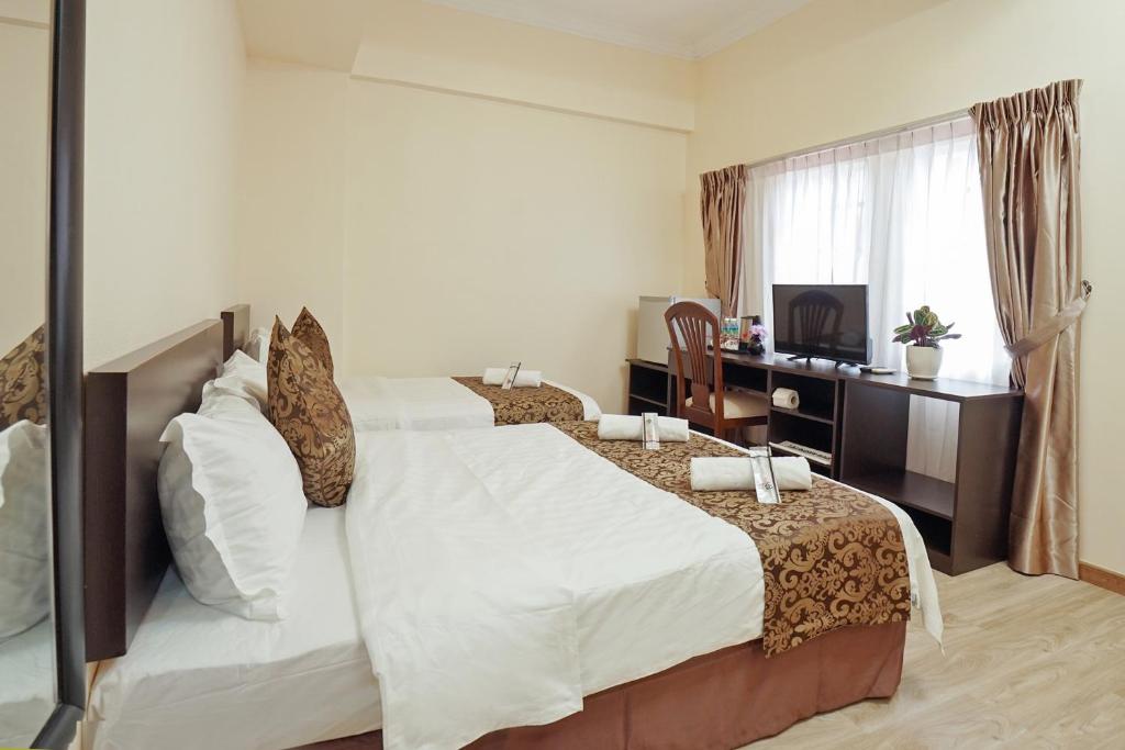 TV a/nebo společenská místnost v ubytování RJ Hotel Kulai