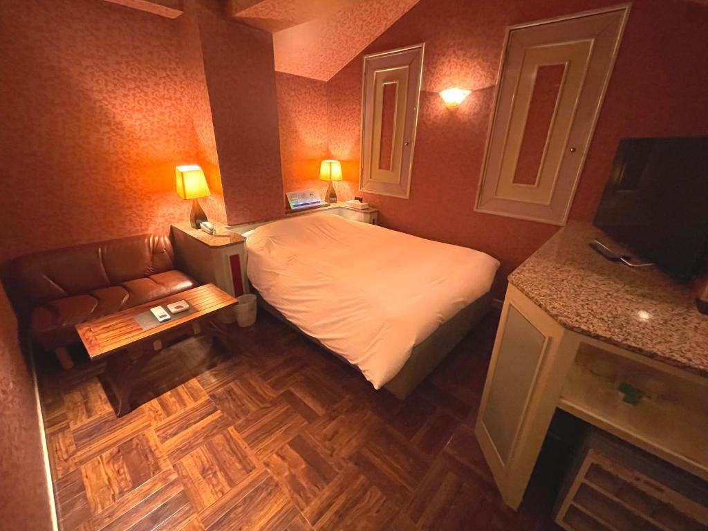 Postel nebo postele na pokoji v ubytování HOTEL KID
