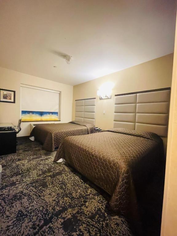 Postel nebo postele na pokoji v ubytování 7 Days Hotel