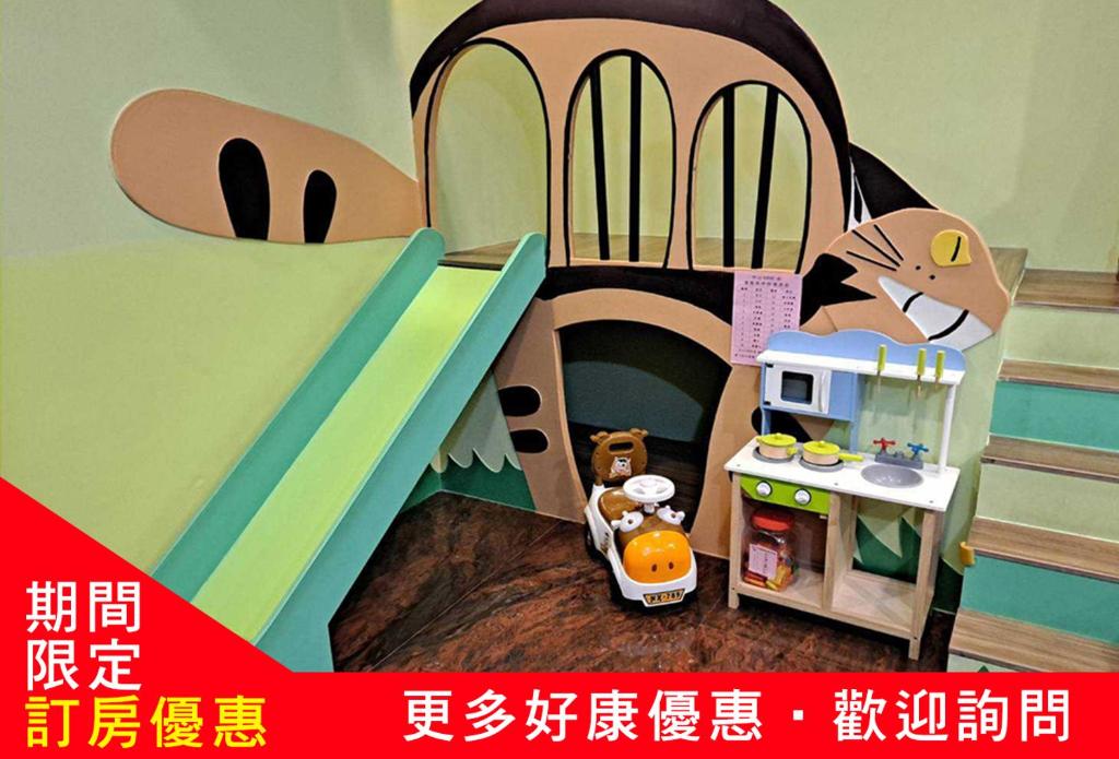 a toy house with a cat inside of it at Zhong Shan 330 in Hualien City