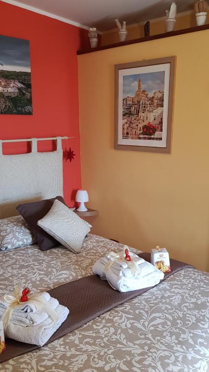 Postel nebo postele na pokoji v ubytování Sassi's Loft