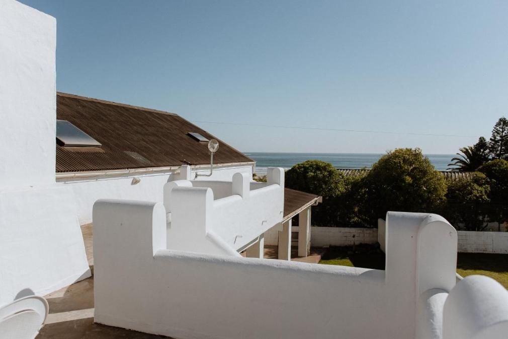 a white building with a view of the ocean at Craylord in Paternoster