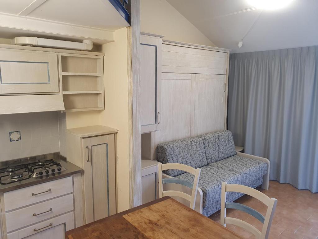 Kuchyň nebo kuchyňský kout v ubytování Hotel Le Tre Isole