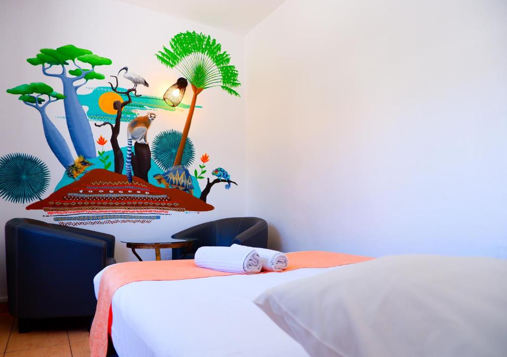 Postel nebo postele na pokoji v ubytování Hôtel Du Cirque