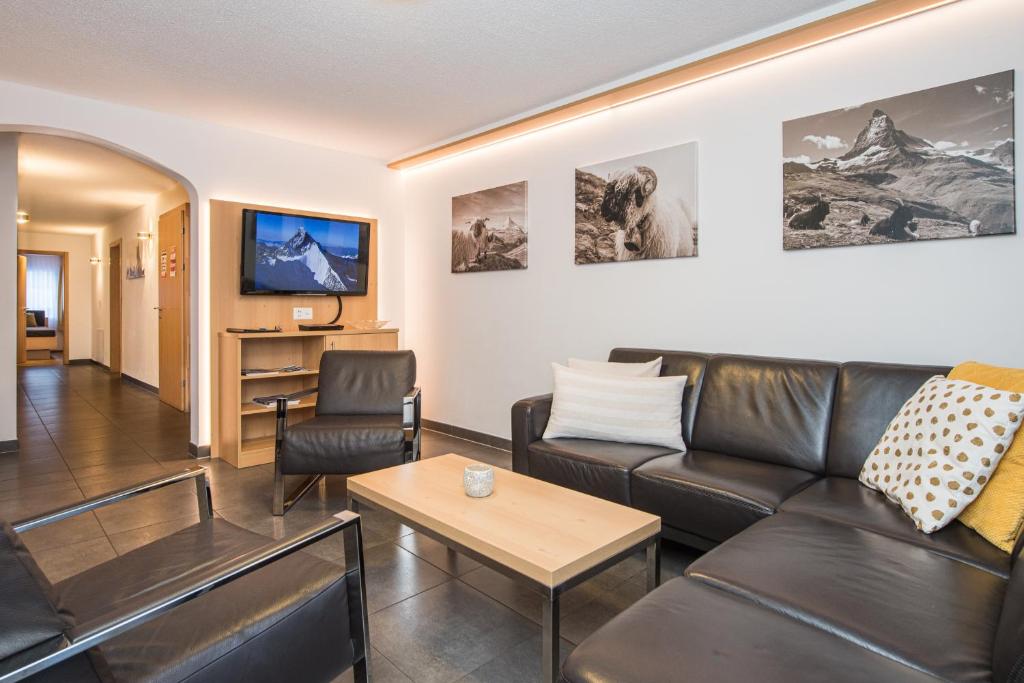 TV a/nebo společenská místnost v ubytování Ferienhaus Matterhorngruss