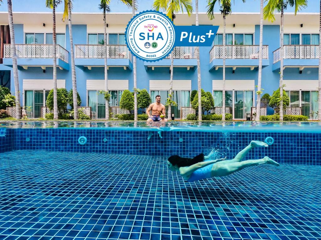 a swimmer in the pool at the hotel at Blu Marine Hua Hin Resort and Villas - SHA Plus in Hua Hin