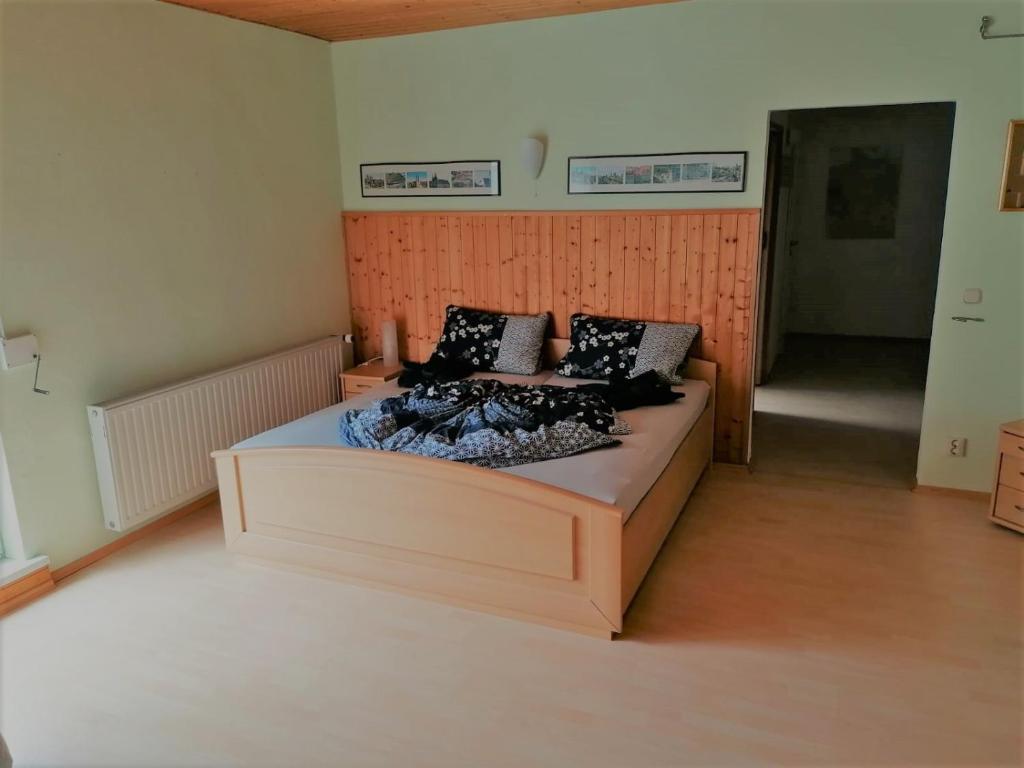 a bedroom with a large bed in a room at Ferienwohnung Kahlenberg in Thale
