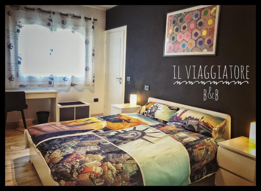 A bed or beds in a room at Il Viaggiatore B&B