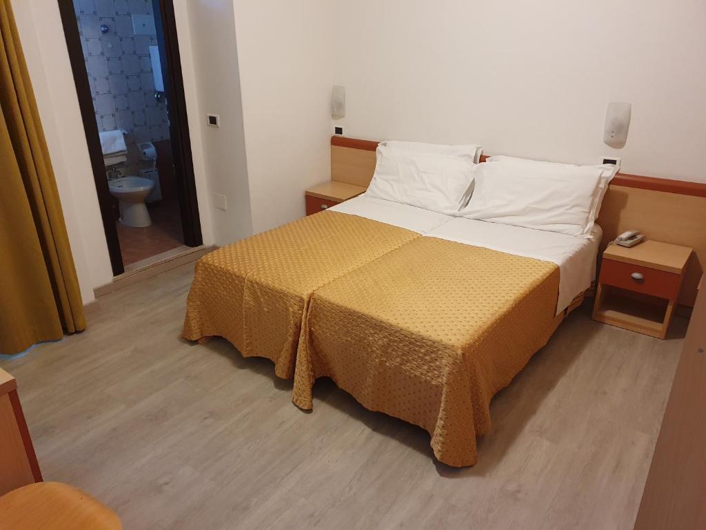 Postel nebo postele na pokoji v ubytování Hotel Tilmar