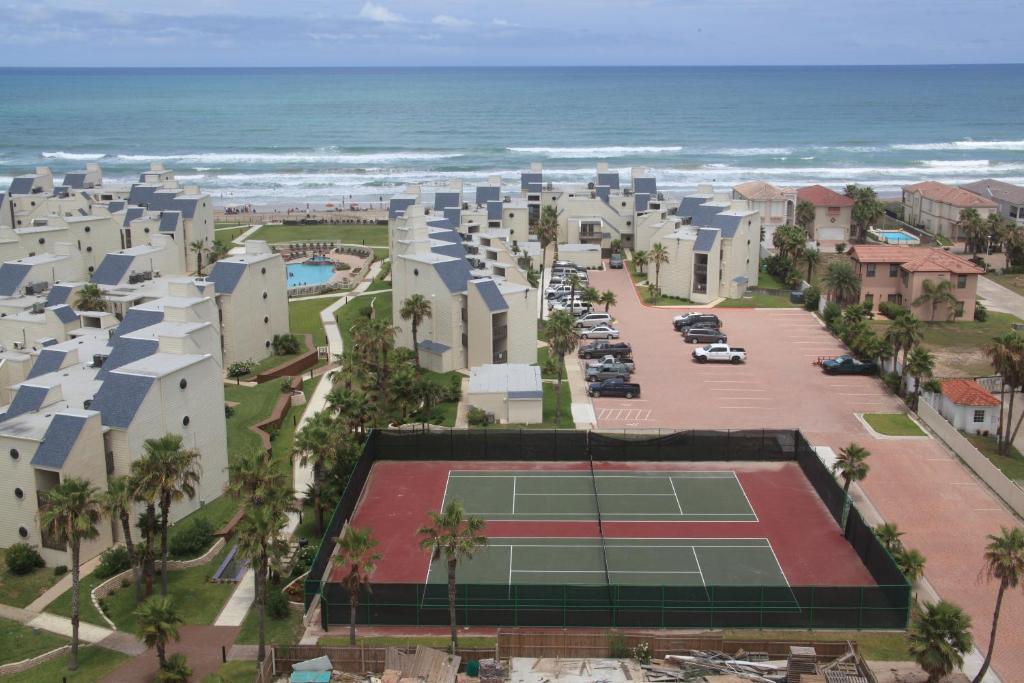 an aerial view of a tennis court next to the ocean at Villas at Bahia Mar in South Padre Island