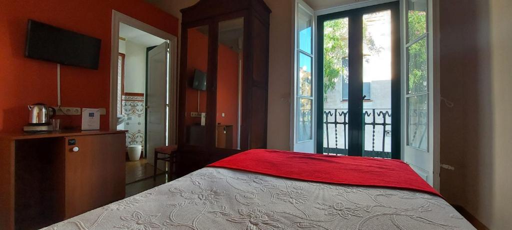 Postel nebo postele na pokoji v ubytování Hotel Noucentista