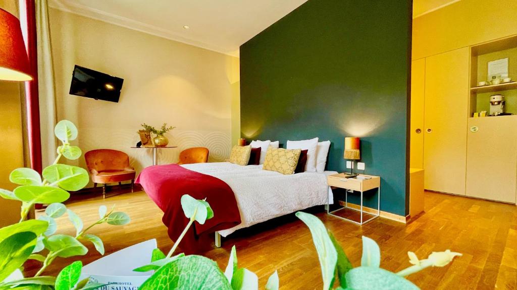 TV a/nebo společenská místnost v ubytování Parkhotel du Sauvage
