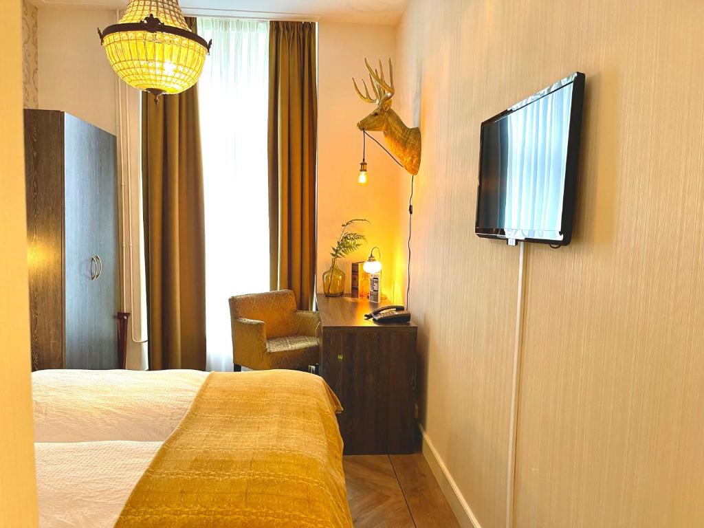 Postel nebo postele na pokoji v ubytování Parkhotel du Sauvage