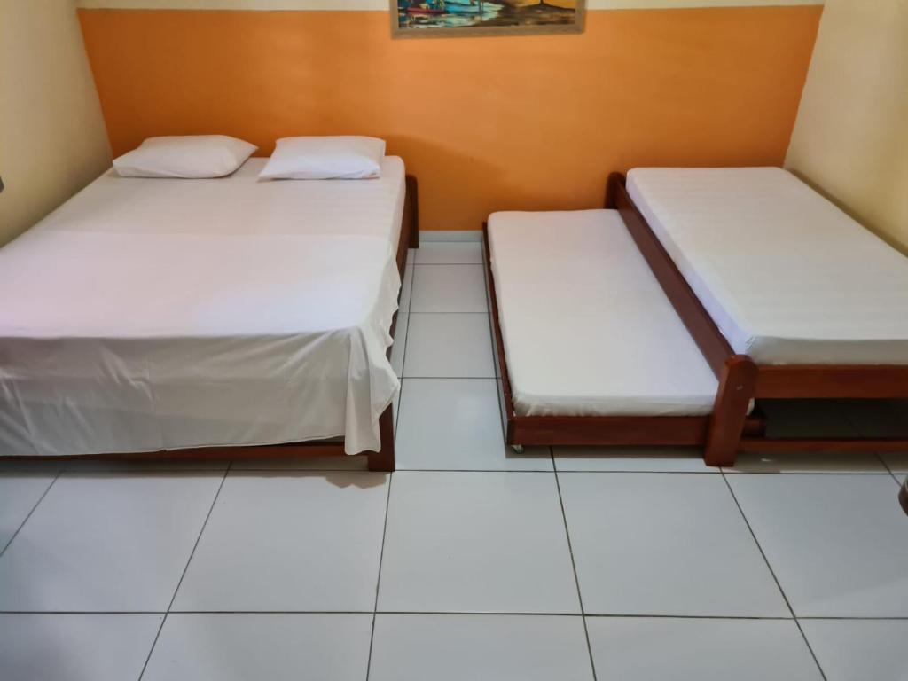 Postel nebo postele na pokoji v ubytování Pousada Sonho de Mar