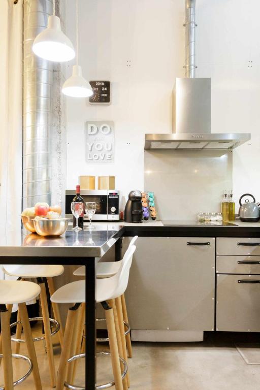 Kuchyň nebo kuchyňský kout v ubytování MonKeys Apartments Luxury MetaLoft