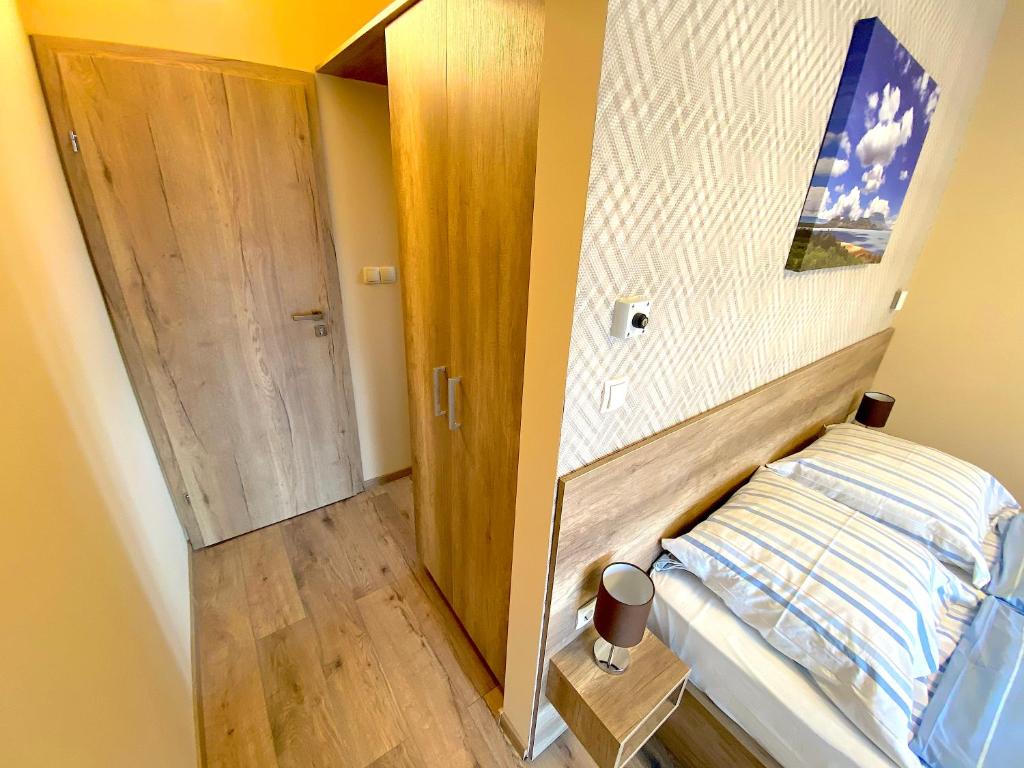 Postel nebo postele na pokoji v ubytování Unio Vendégház 2