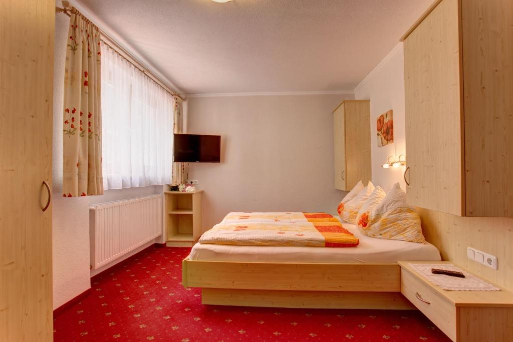Postel nebo postele na pokoji v ubytování Alpenruh