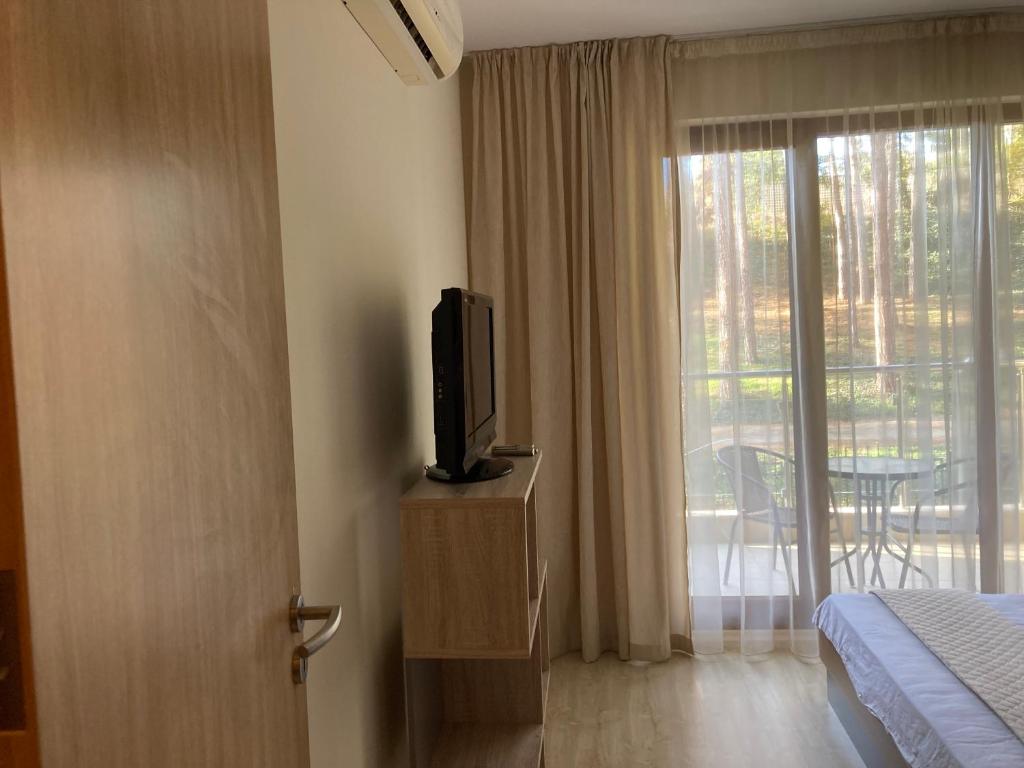 A television and/or entertainment centre at BOTANICA PRIME