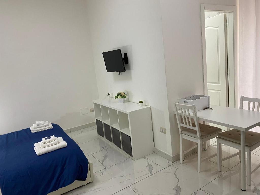 Televízia a/alebo spoločenská miestnosť v ubytovaní Conforti Apartment