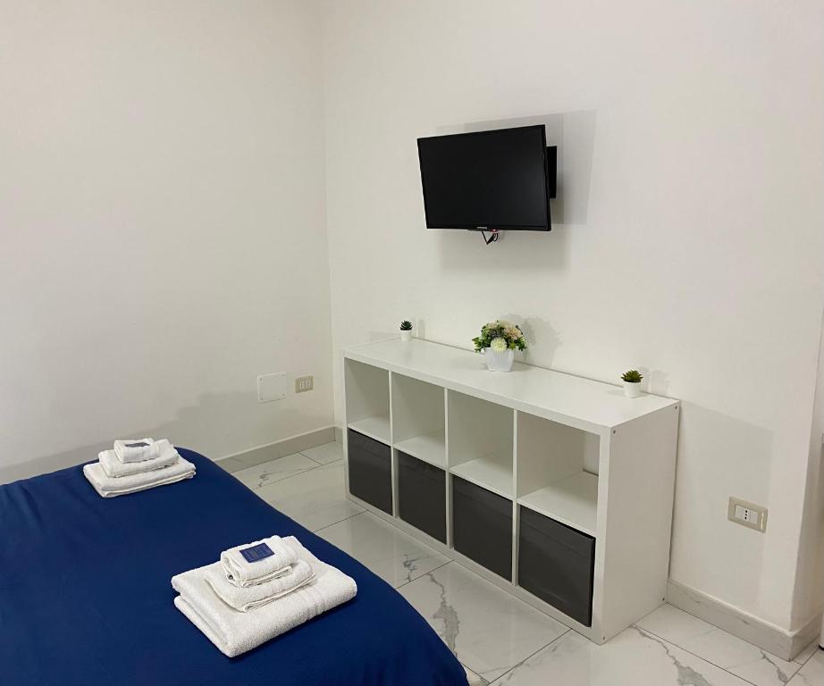 Televízia a/alebo spoločenská miestnosť v ubytovaní Conforti Apartment