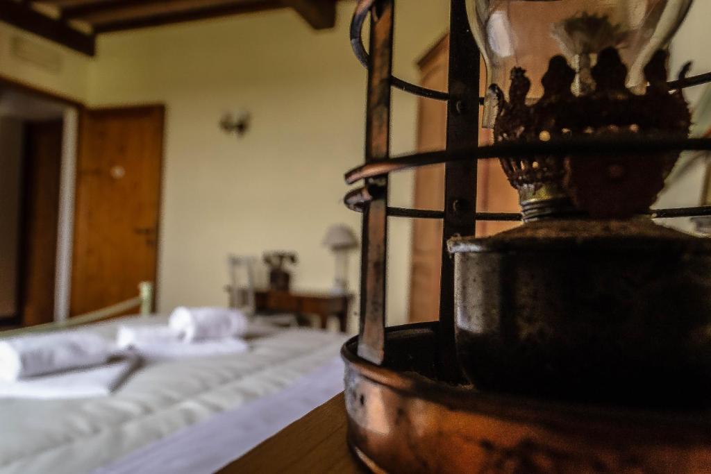 Postel nebo postele na pokoji v ubytování Agriturismo L'Olmo