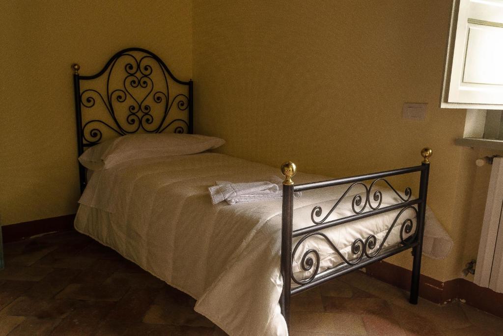 Postel nebo postele na pokoji v ubytování Agriturismo L'Olmo