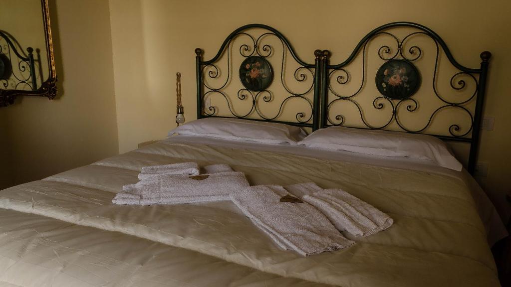 Postel nebo postele na pokoji v ubytování Agriturismo L'Olmo