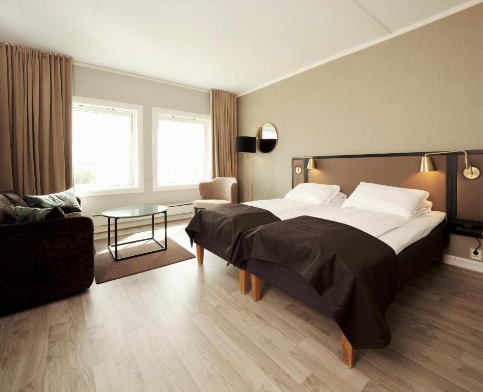 Postel nebo postele na pokoji v ubytování Røros Hotell - Bad & Velvære