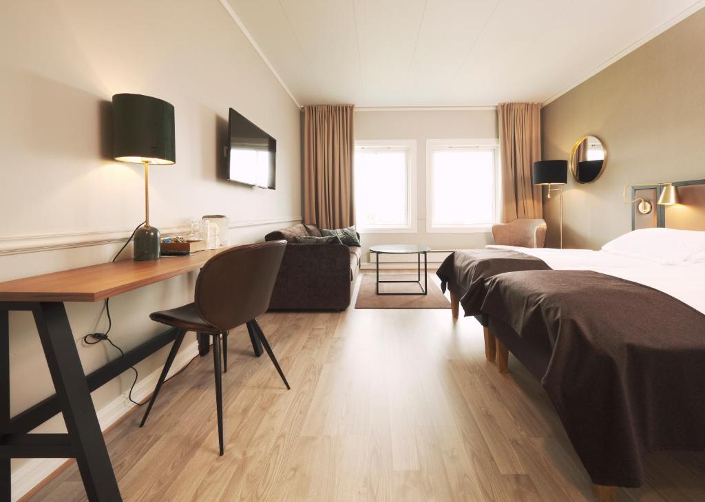 Postel nebo postele na pokoji v ubytování Røros Hotell - Bad & Velvære