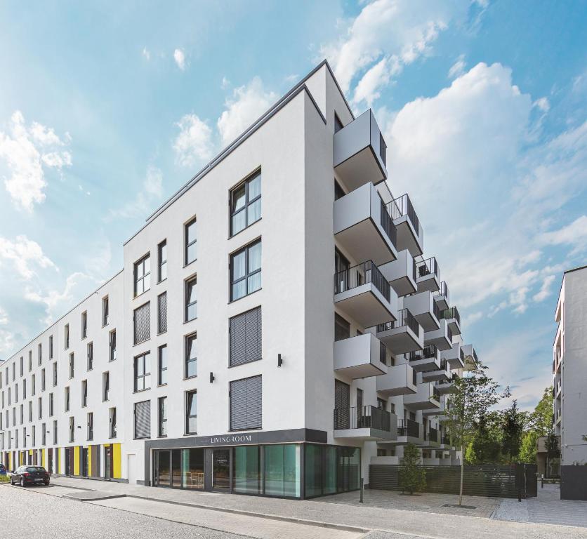 an architectural rendering of a white building at Livingroom Bad Homburg Boardinghouse in Bad Homburg vor der Höhe