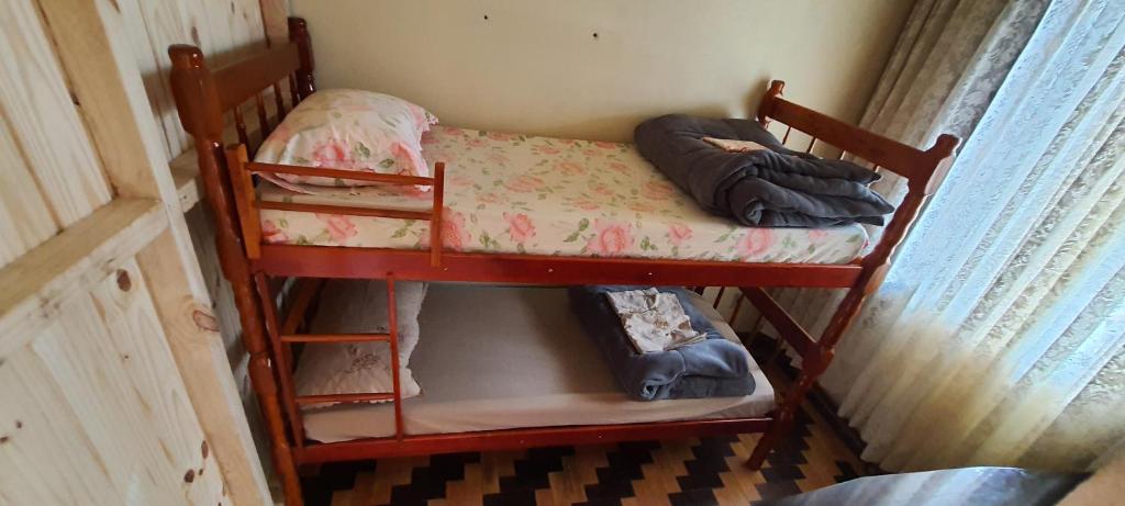 Postel nebo postele na pokoji v ubytování Hostel Caxias do Sul