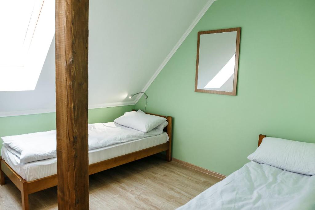 Postel nebo postele na pokoji v ubytování Sweet Home Hostel