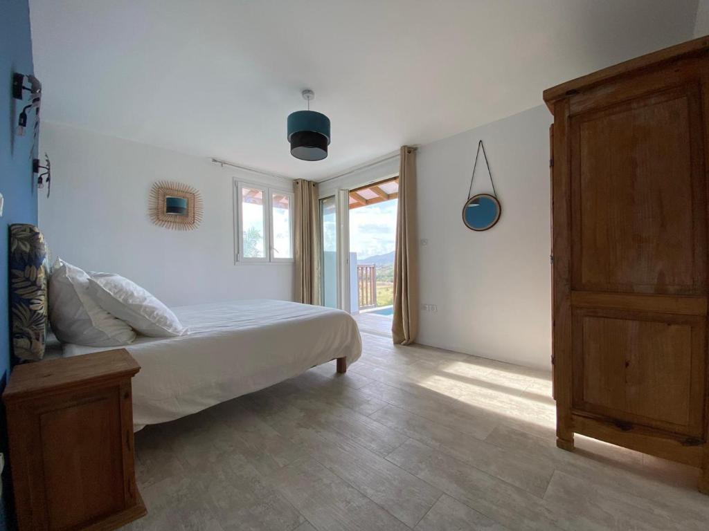 Postel nebo postele na pokoji v ubytování La Maison