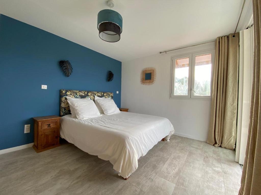 Postel nebo postele na pokoji v ubytování La Maison