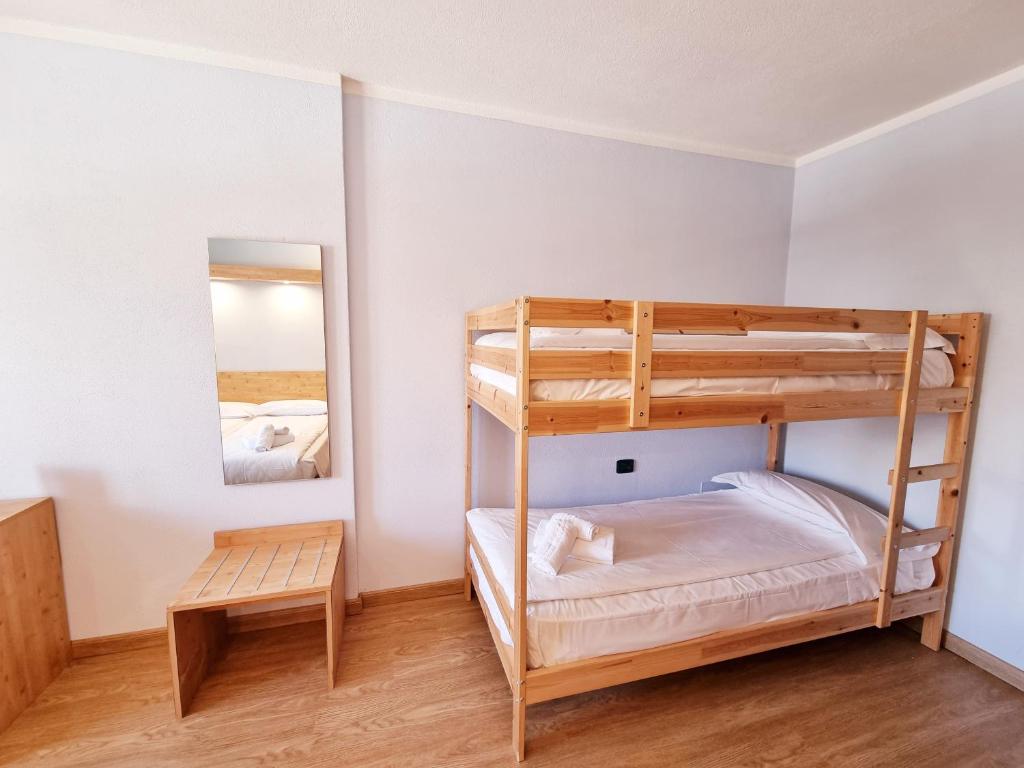 Postel nebo postele na pokoji v ubytování Hotel San Carlo, tra Bormio e Livigno