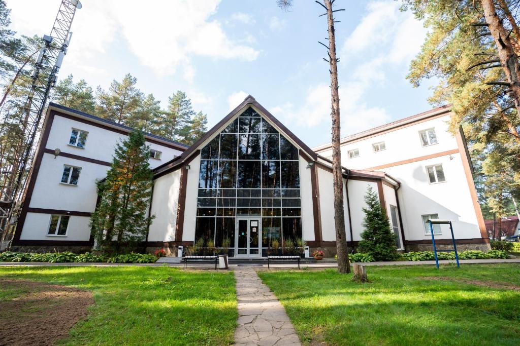 an exterior view of a building with a large window at Парк Отель Русский in Serpukhov