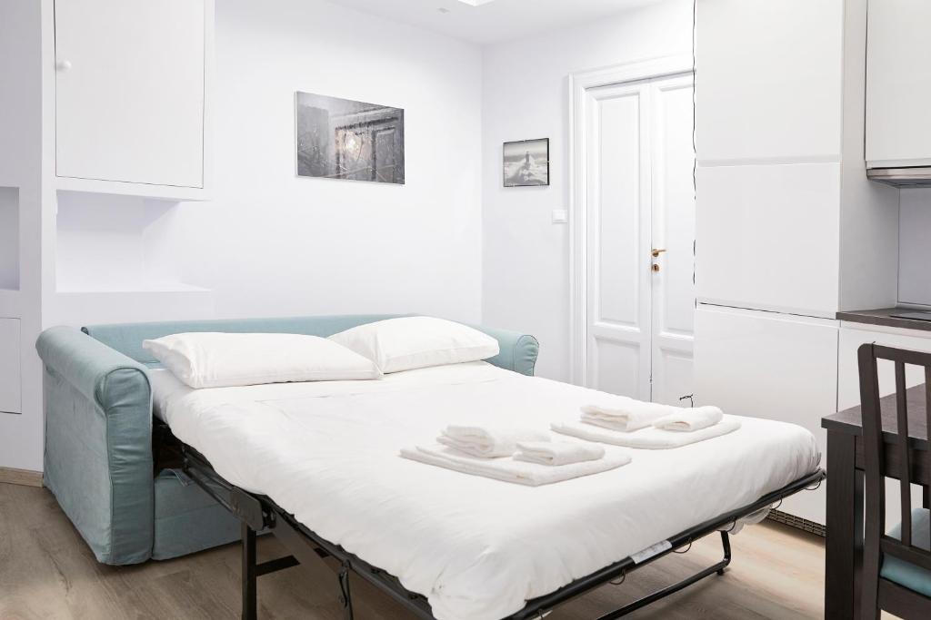 Posteľ alebo postele v izbe v ubytovaní Prestige Boutique Homes - Navigli