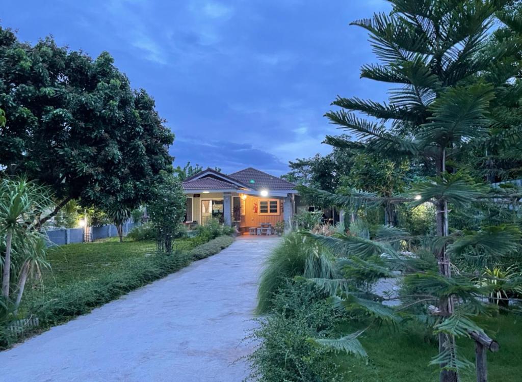 a home with a driveway leading to a house at Pimmada@Khao Yai in Ban Khanong Phra Klang (1)