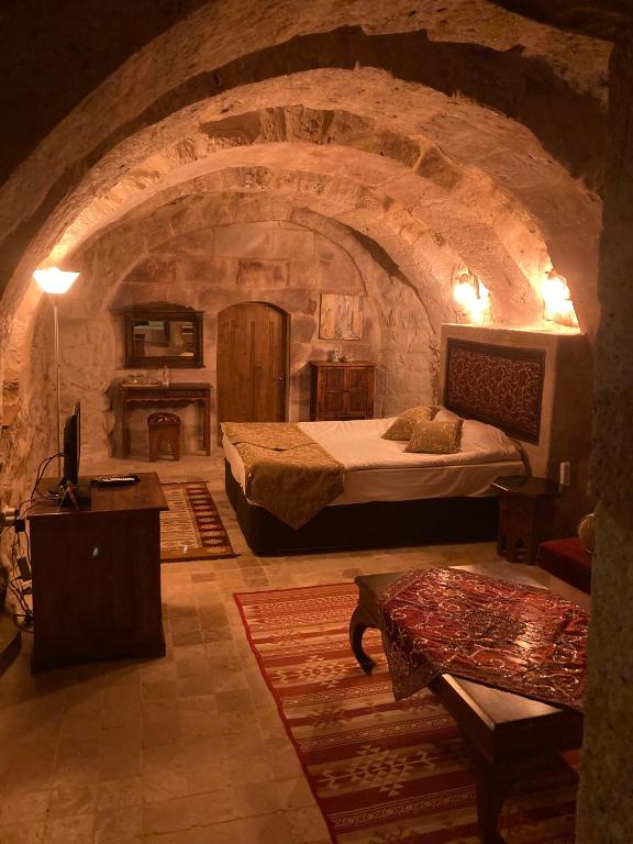 Postel nebo postele na pokoji v ubytování Monte Cappa Cave House
