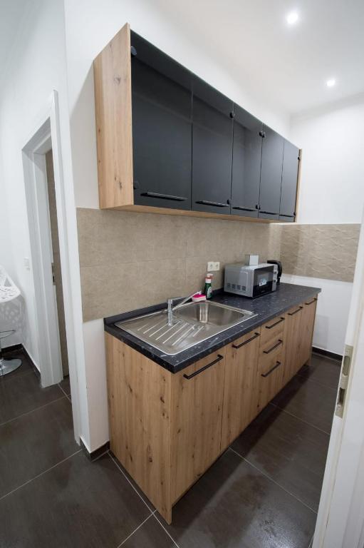 Kuchyňa alebo kuchynka v ubytovaní Apartman Slay