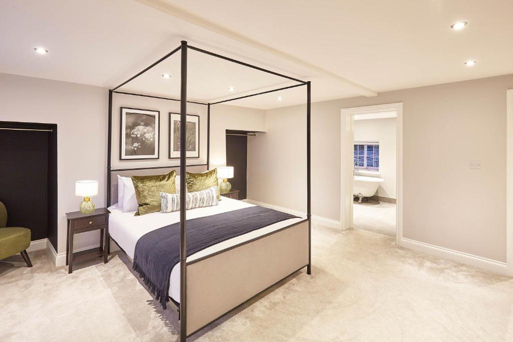 a bedroom with a canopy bed in a room at Host & Stay- Graham House in Osmotherley